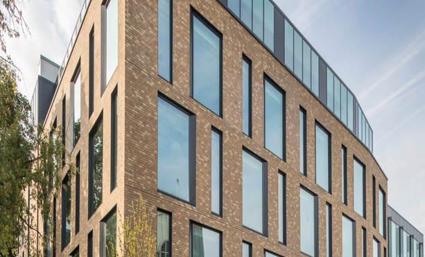 A modern office building with glass facade, representing our commercial property portfolio